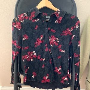 Antique looking black blouse with floral accent
